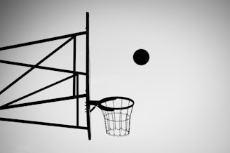 grayscale photo of ball about to shoot