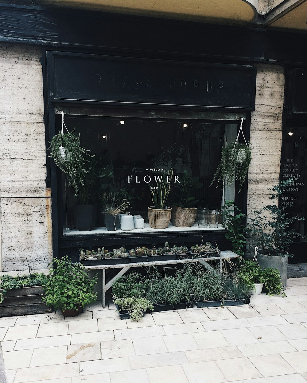 black wooden flower shop front