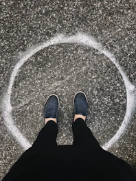 person in black pants and shoes
