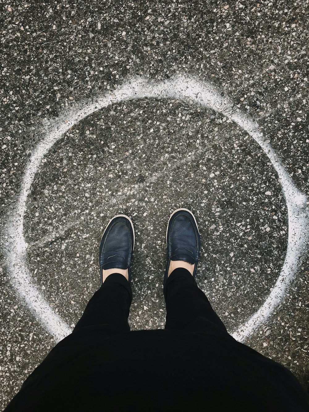 person in black pants and shoes