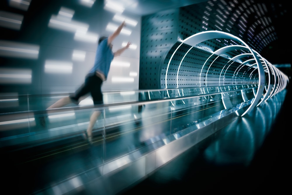 man jumps on escalator