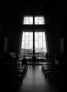 Interior of the church during the early morning Holy Qurbana, with faithful gathered in prayer.