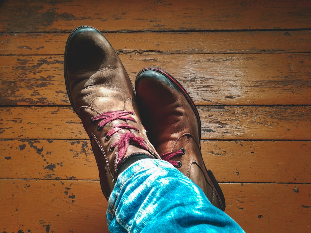 close-up photo of person wearing brown dress shoes