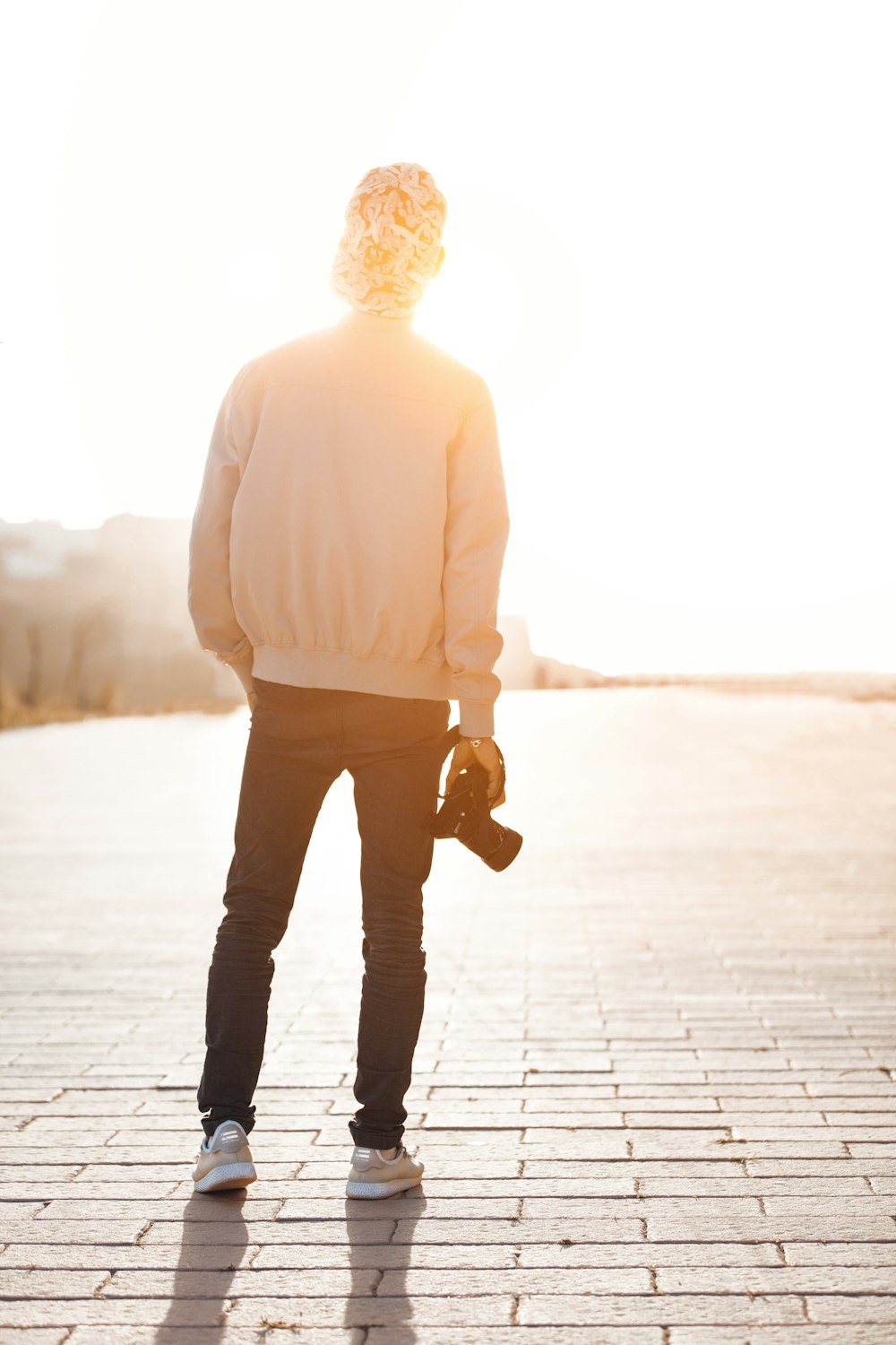 person standing while holding camera