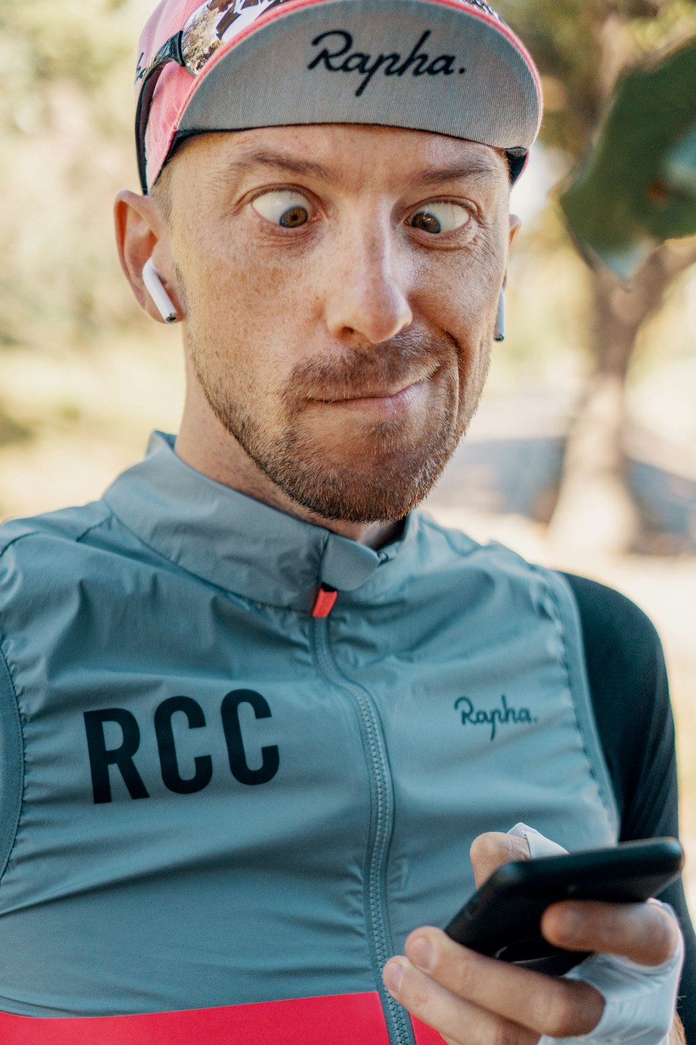 closeup photo of man holding phone