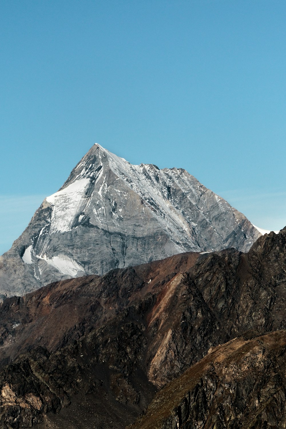 brown and gray mountain under blue sky