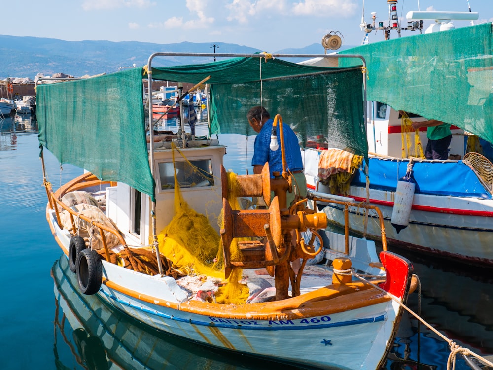 man standing on boat