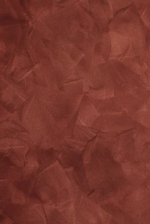 a red background with a rough texture of paper
