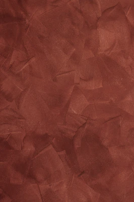 a red background with a rough texture of paper