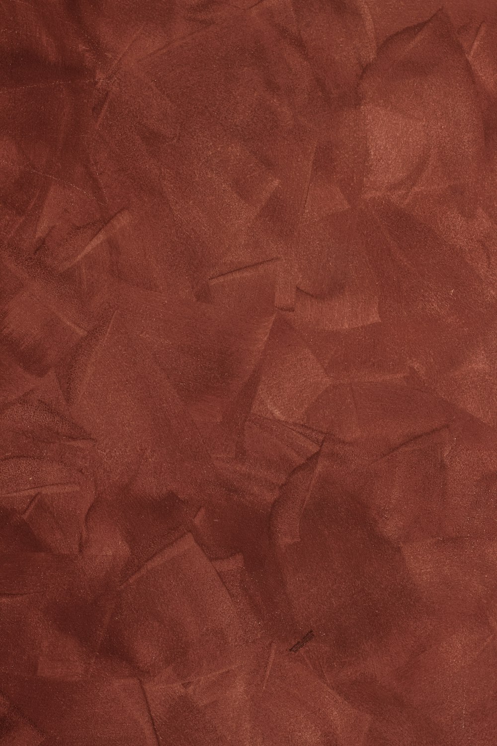 a red background with a rough texture of paper