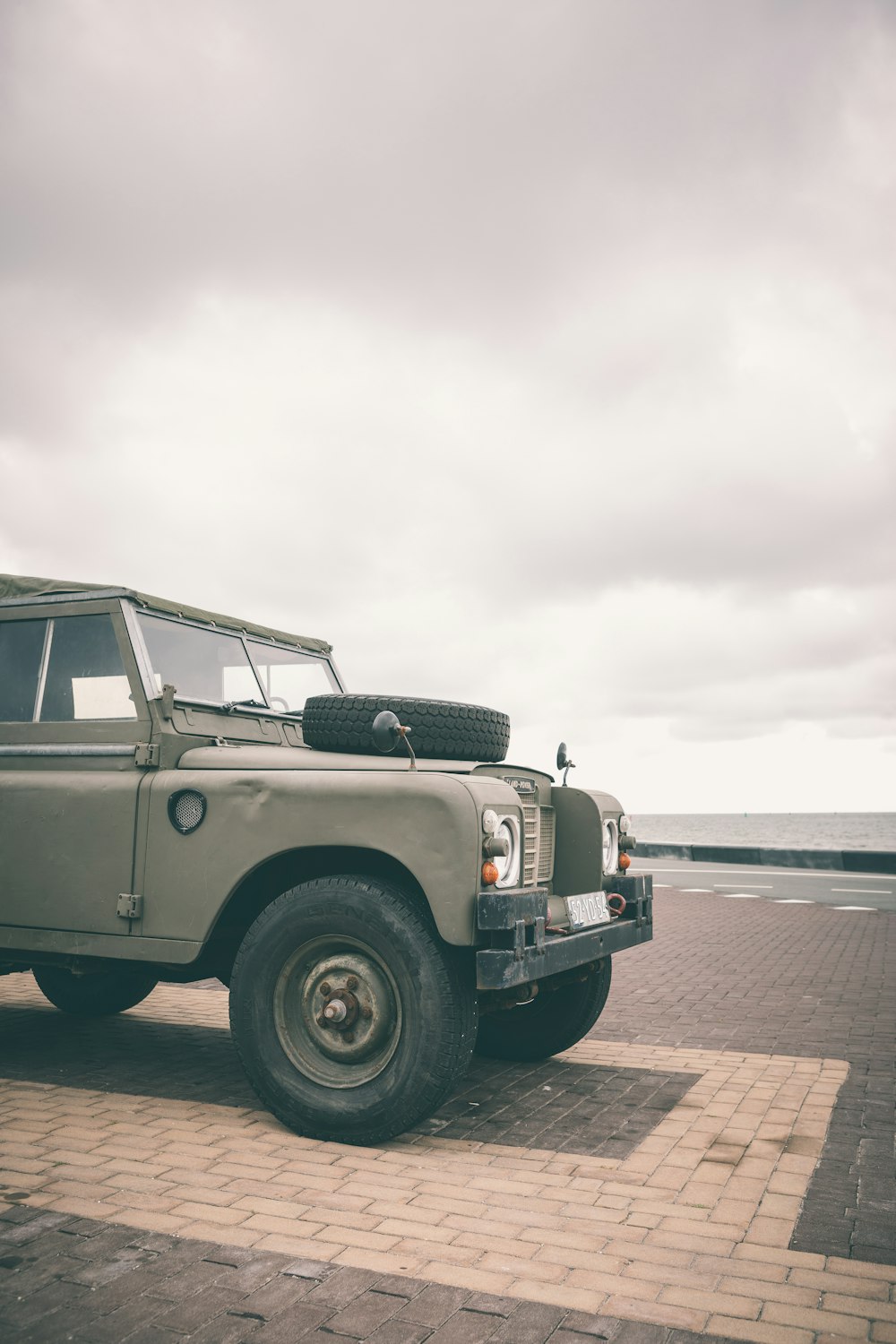 gray vehicle under gray sky at daytime