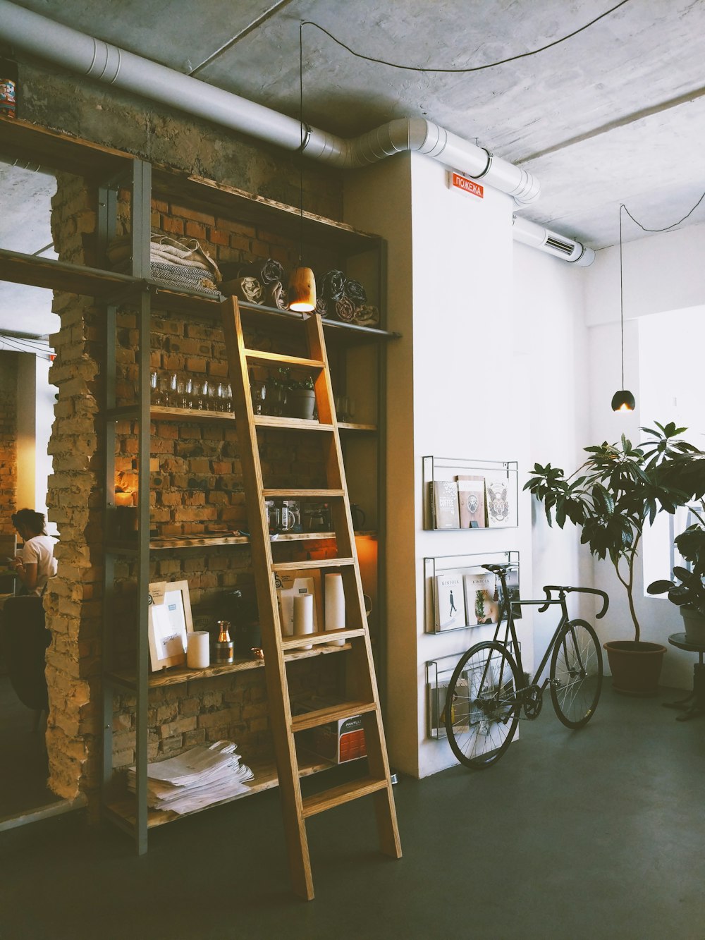 brown wooden ladder beside rack