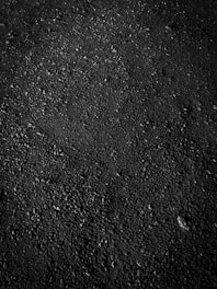 Close-up of natural garnet abrasive used in low-pressure cleaning.