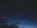 A serene night sky with a glowing crescent moon and twinkling stars reflecting calm and guidance.