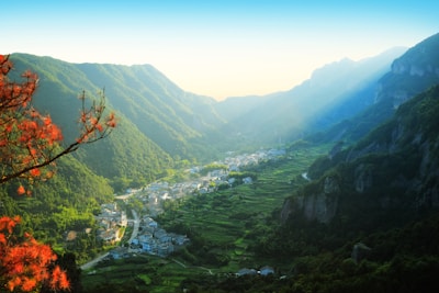 A serene landscape of Vietnam’s lush green mountains and winding rivers at sunrise.