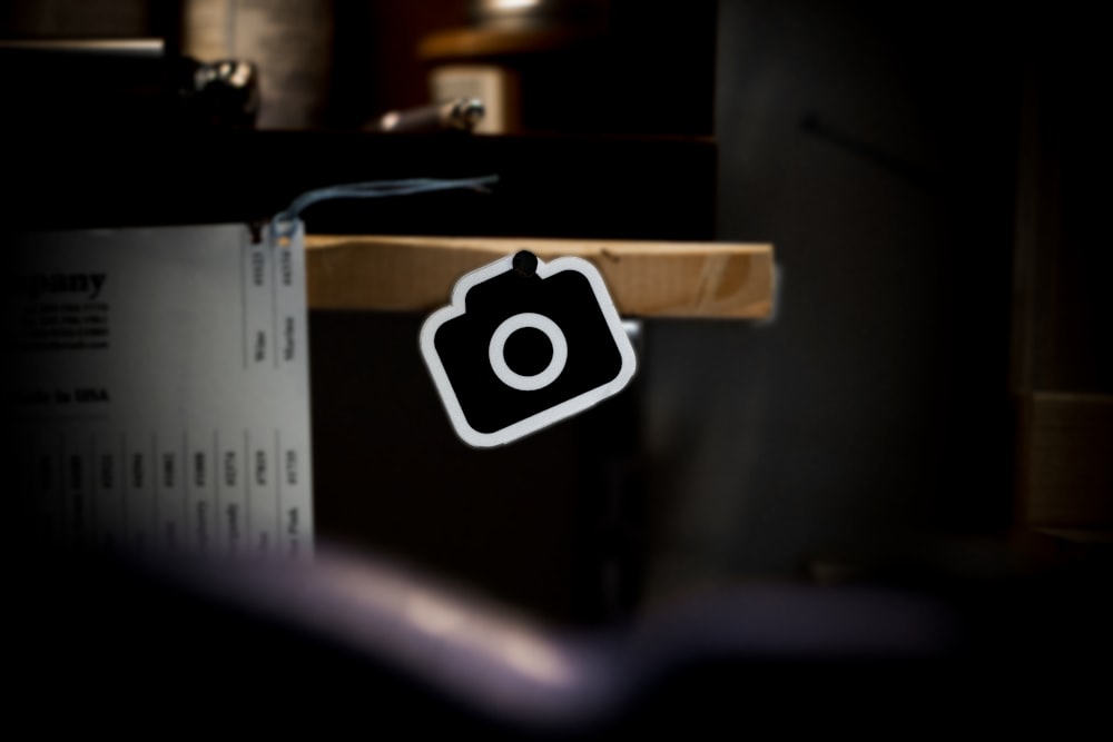 a camera sitting on top of a wooden table