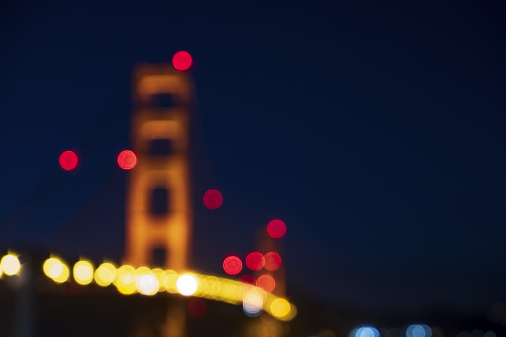 a blurry photo of the golden gate bridge at night