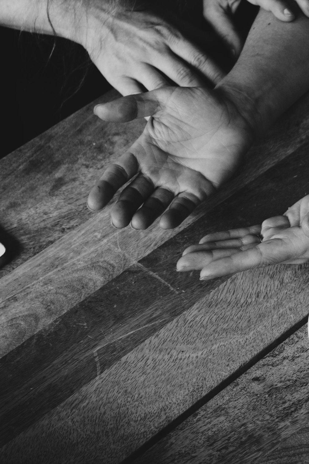 grayscale photo of hands