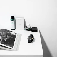 A minimalist setup featuring a sleek, modern toy resting on a wooden surface.