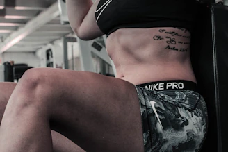 woman wearing gray and white Nike Pro shorts