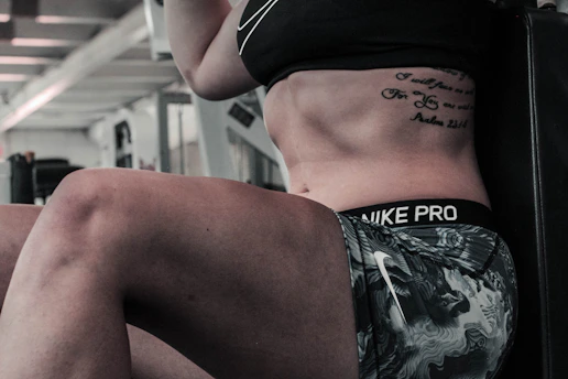 woman wearing gray and white Nike Pro shorts