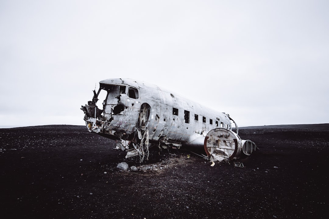 wrecked gray military airplane