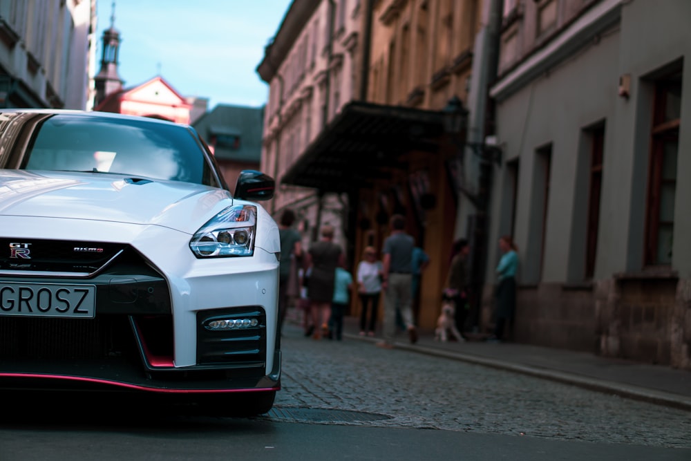 shallow focus photography of white sports car