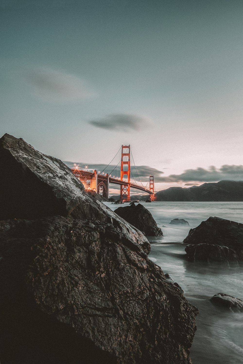 orange bridge near mountain