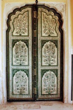 Laser-cut designer door showcasing delicate floral patterns.