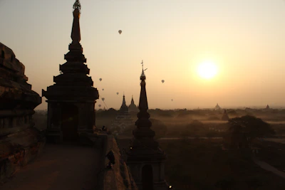 Sunrise view of a hot air balloon floating over the temples of Bagan, Myanmar.
