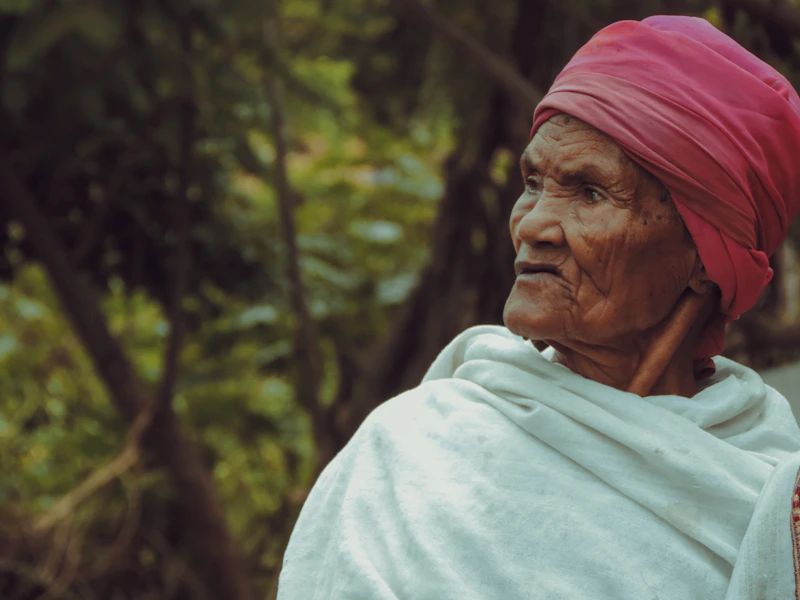 Indian woman's red headscarf and white top