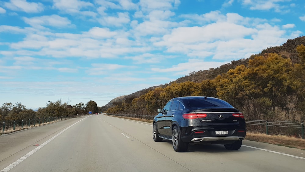 black sedan on road