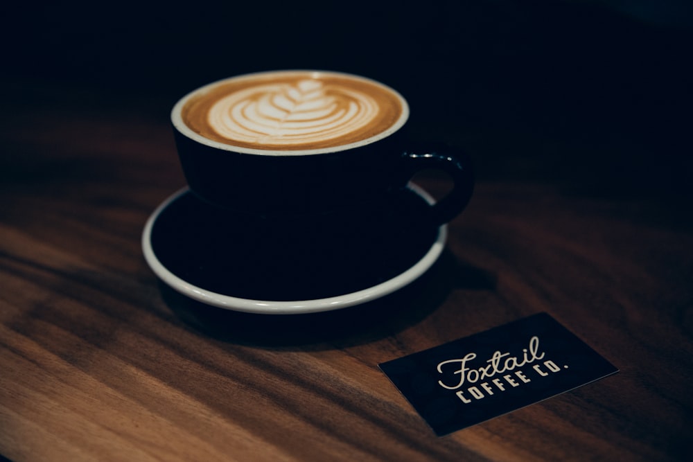 black ceramic coffee cup with saucer