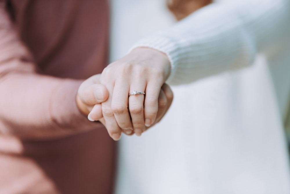 two person holding hands