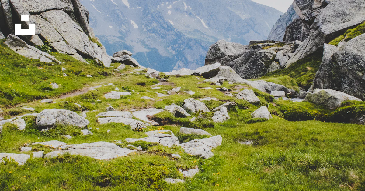 Fgrass Foeld Rocks Green grass field near rock formations photo – Free Blue Image on Unsplash