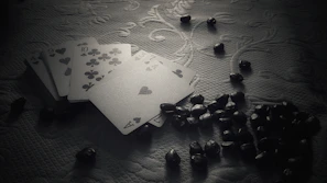 Minimalist arrangement of the game cards with glowing ember textures and a hint of smoke.