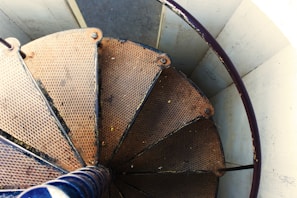 Side view of a sturdy metal staircase with wooden steps, showcasing craftsmanship