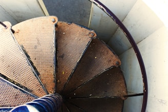 Side view of a sturdy metal staircase with wooden steps, showcasing craftsmanship