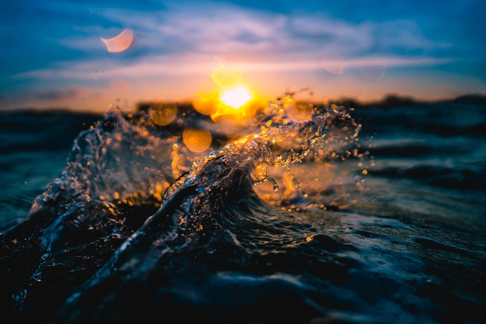 body of water during sunset