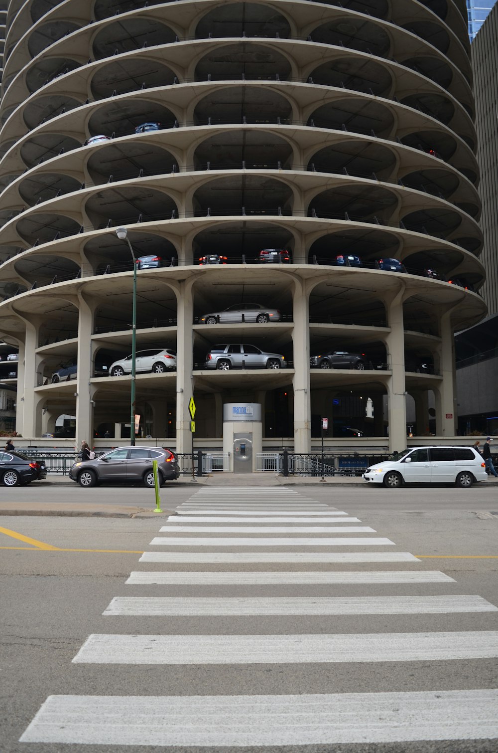 white car parked in front of building