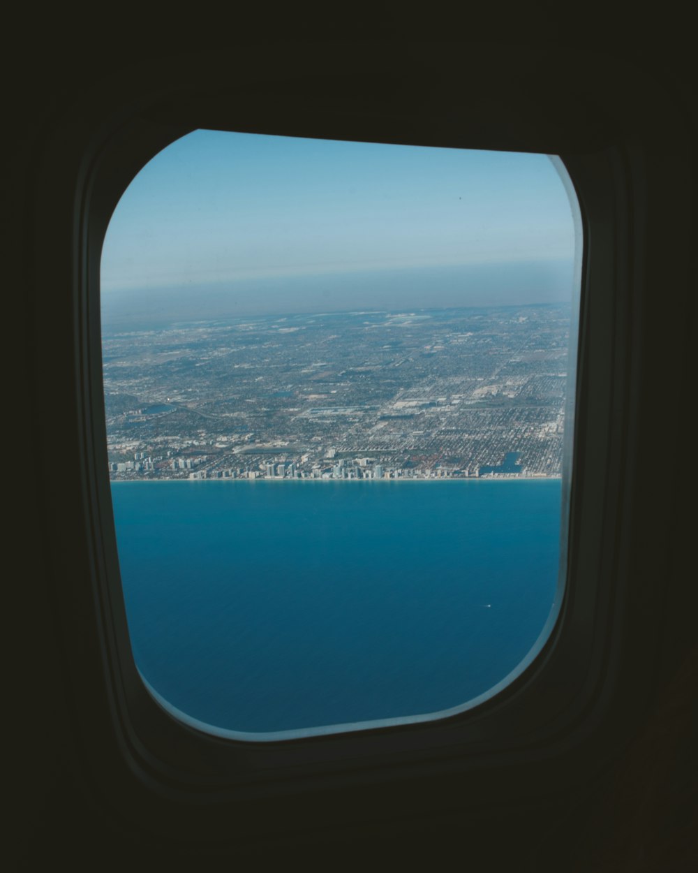 a view of the ocean from an airplane window