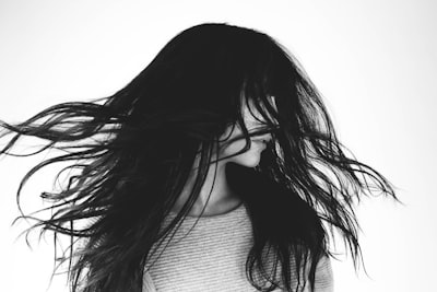 grayscale photography of woman hair teams background