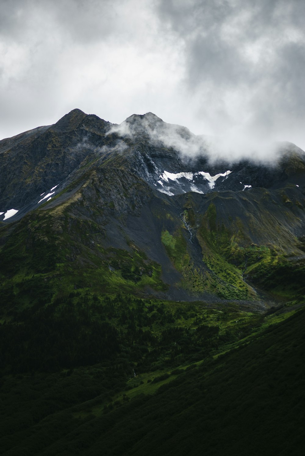 mountain under cloudy sky