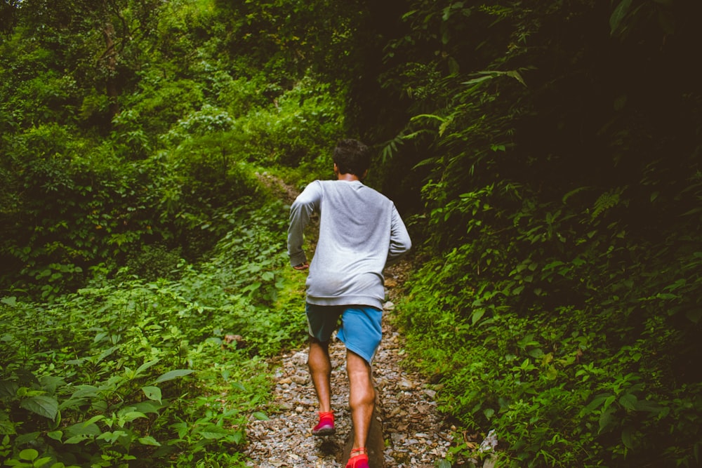 man running in forest