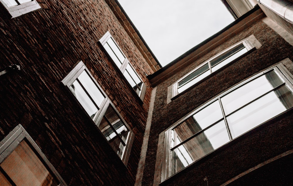 low angle photography of brown building