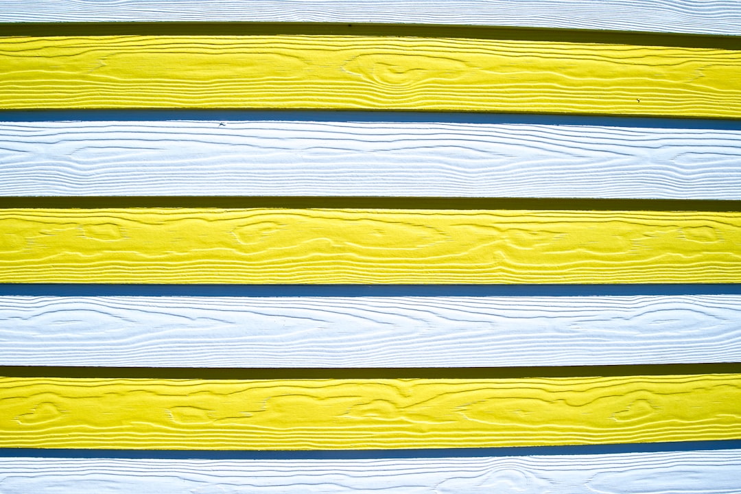 white, blue, and yellow wooden board