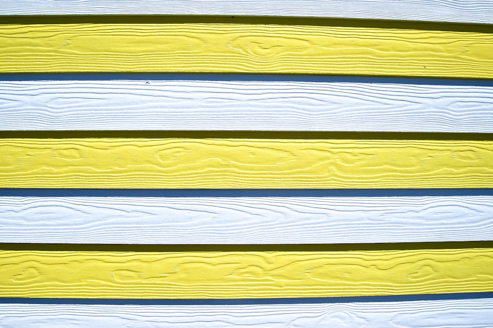 white, blue, and yellow wooden board