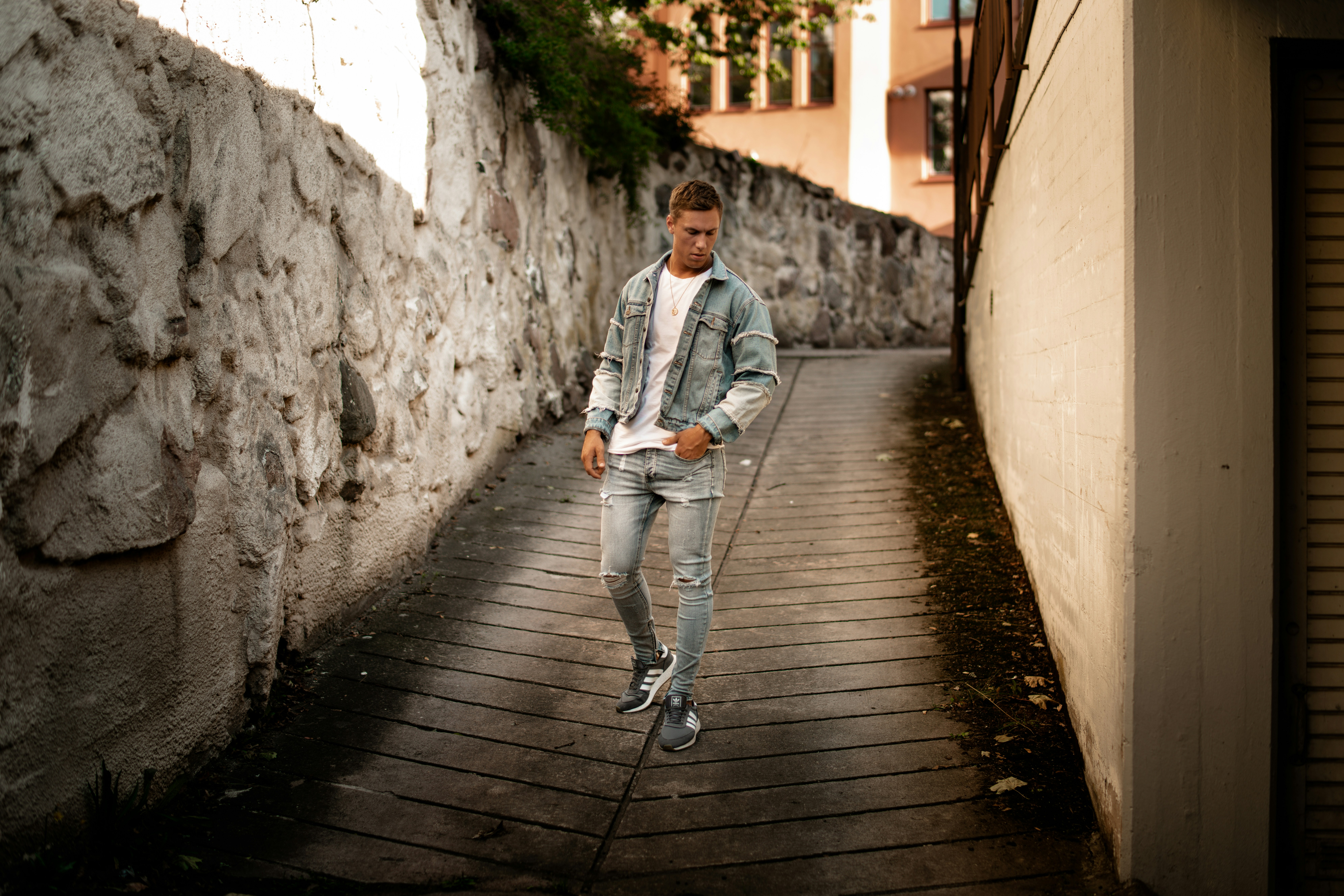 man standing in the alley