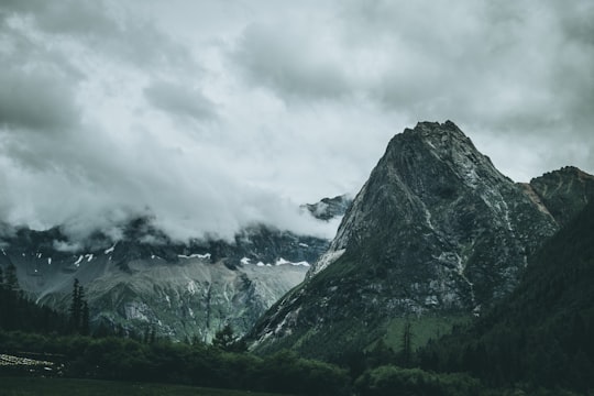 landscape photography of mountain under sky in Siguniang Mountain China