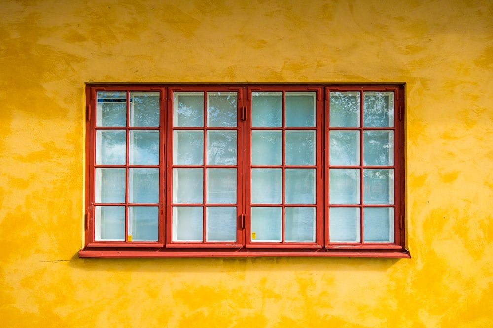 red framed glass casement windows
